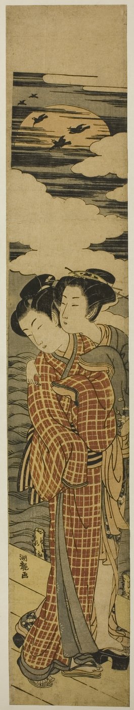 Couple debout sur une jetée s