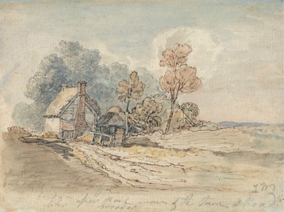Un cottage au toit de chaume et des arbres au tournant d