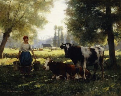 Une laitière avec ses vaches par une journée d