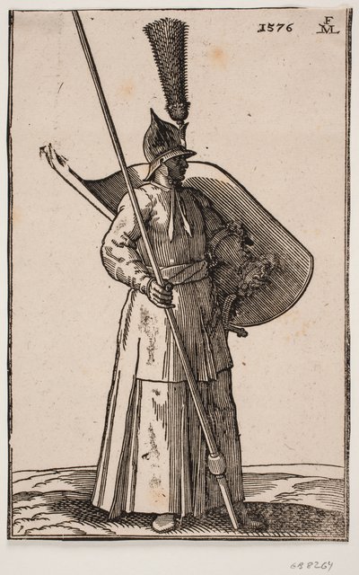 Soldat debout, tourné vers la droite; portant un casque pointu avec une grande plume; tenant une lance dans la main droite, dont le sommet dépasse le cadre supérieur; portant un bouclier sur le bras gauche avec l