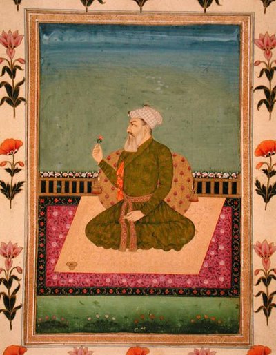 Un dirigeant assis sur un tapis ou une terrasse, tenant une fleur, du Petit Album Clive - Mughal School