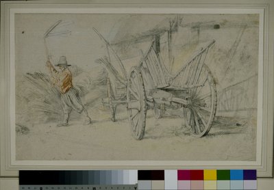 Un homme battant le grain à côté d