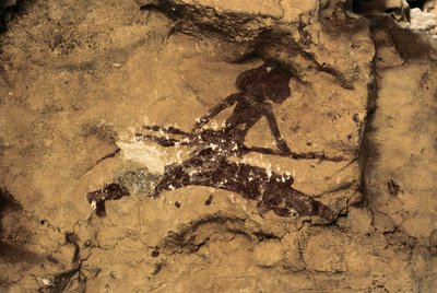Art rupestre : femme chasseresse. Préhistoire, Paléolithique supérieur. Grotte de Tio Garroso, Espagne - Prehistoric Prehistoric