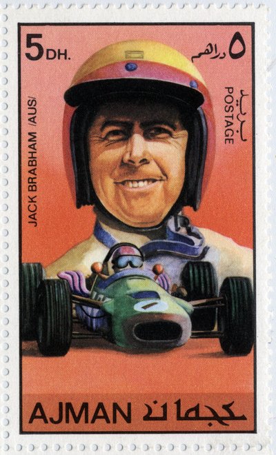Timbre des Émirats représentant le pilote de voiture australien Jack Brabham (né en 1926) - School Arabic