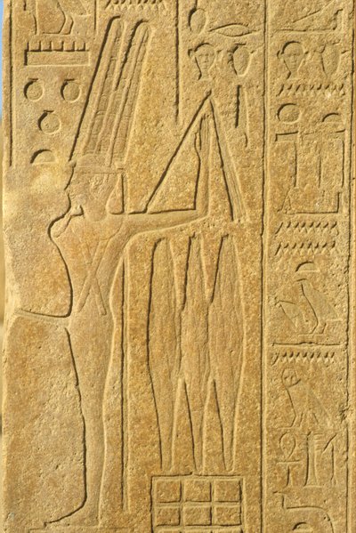 Égypte ancienne, peinture murale/sculpture, le dieu Min, temple de Karnak, Louxor, dieu de la fertilité, tenant un fléau (photo) - School Egyptian