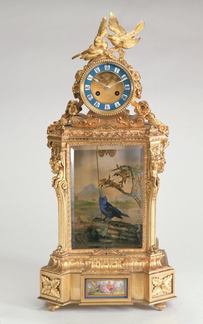 Pendule de cheminée, monture en porcelaine dorée, avec automate d