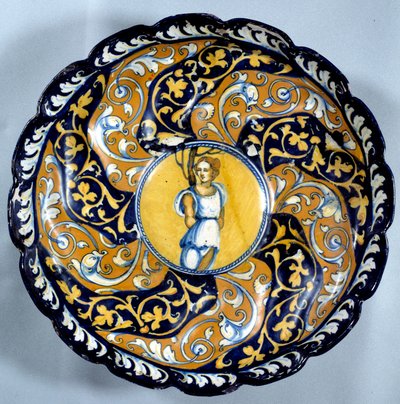 Coupe en faïence godronnée décorée d