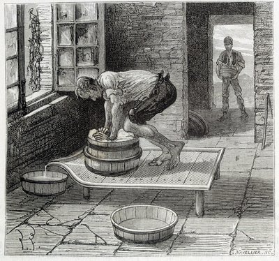 Travail de la Tomme par un fromager d