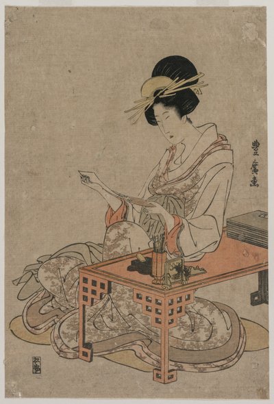 Courtisane assise à une table d