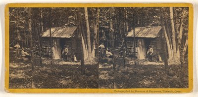 [La famille pose devant sa cabane en rondins dans les bois]. - Whitney and Beckwith