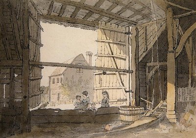 Figures dans une porte de grange à Parsonage House, près d