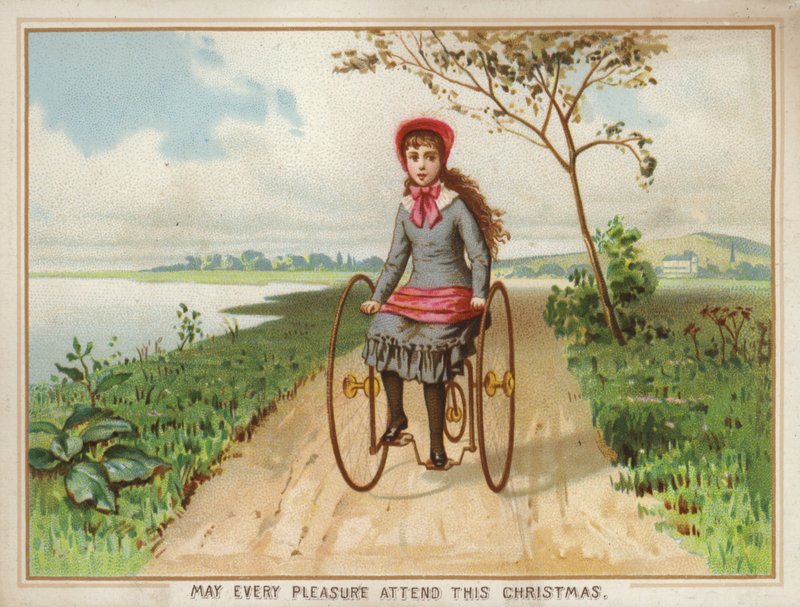 Fille roulant en tricycle à la campagne - American School