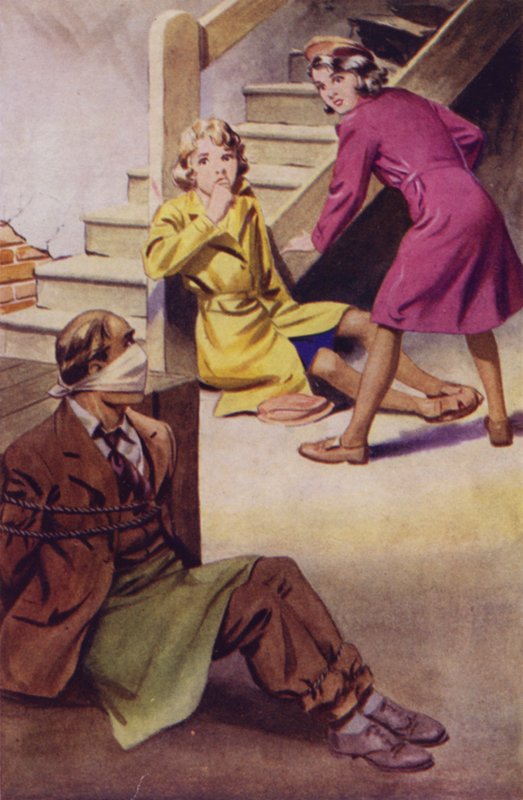 Un homme ligoté, bâillonné et assis par terre tandis que deux filles le regardent - English School