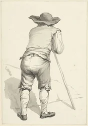 Homme penché sur un bâton, vu de dos