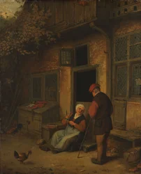 Une femme éventrant des harengs devant sa maison