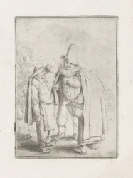 Homme avec une fraise avec un couple de paysans