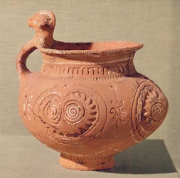 Vase funéraire avec une poignée anthropomorphe