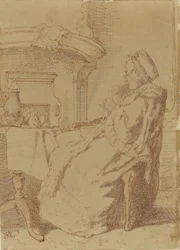 Vieille femme assise tricotant à une table