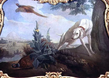 Chien avec gibier dans un paysage