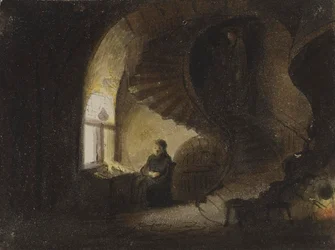 Homme assis près d’une fenêtre