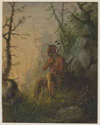 Un Indien Sioux devant une tombe