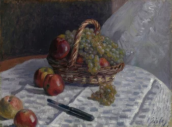 Pommes et raisins dans un panier