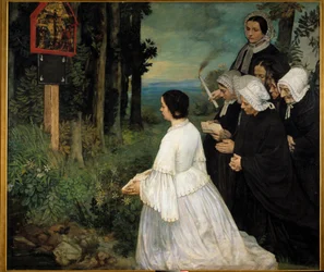 Les femmes en costumes traditionnels bretons se rassemblant devant un ex-voto