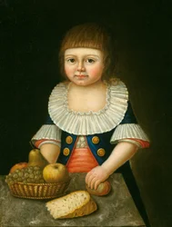 Garçon avec un panier de fruits