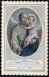 Image pieuse : Jésus enfant dans les bras de Joseph