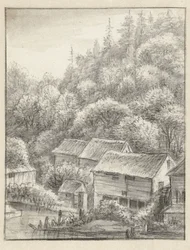 Maisons contre une colline boisée