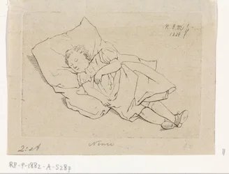 Enfant endormi sur un coussin