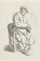 Homme assis dans un fauteuil