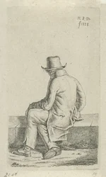 Homme assis sur un muret