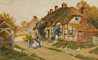 Enfants jouant devant un cottage dans un village