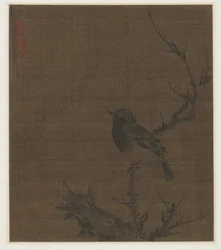 Oiseau endormi sur une branche de prunus