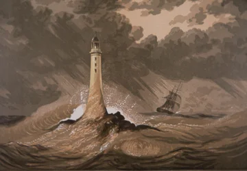 Phare avertissant les navires des rochers en mer agitée