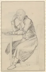 Homme assis à une table