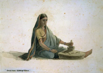 La femme du Syce, moulant du grain, Inde