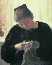 Une femme cousant