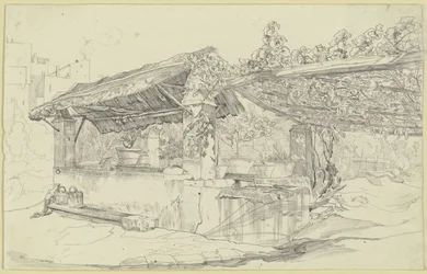 Puits couvert de chaume et lavoir à côté d