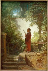 Lecteur de journal dans le petit jardin de la maison