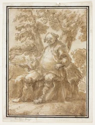 Homme assis devant des arbres
