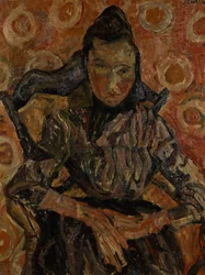 Femme assise dans un fauteuil