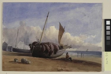 Bateau de pêche échoué avec pêcheur assis