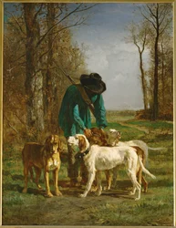 Garde-chasse arrete pres de ses chiens