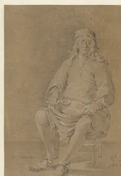 Homme assis avec un bol sur les genoux