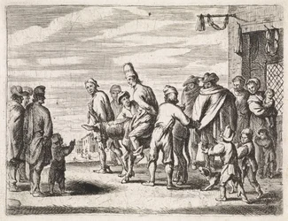 Homme sur un âne attaché