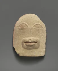 Relief votif en calcaire des yeux et d