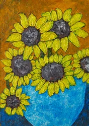 Des tournesols dans un vase bleu