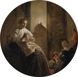 Une femme cousant à la lueur d